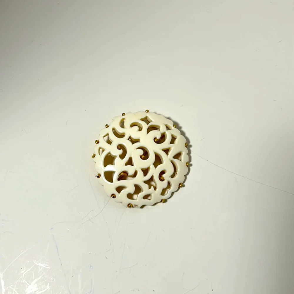 Monet brooch vintage filigree gold tone white cut out design 2 “